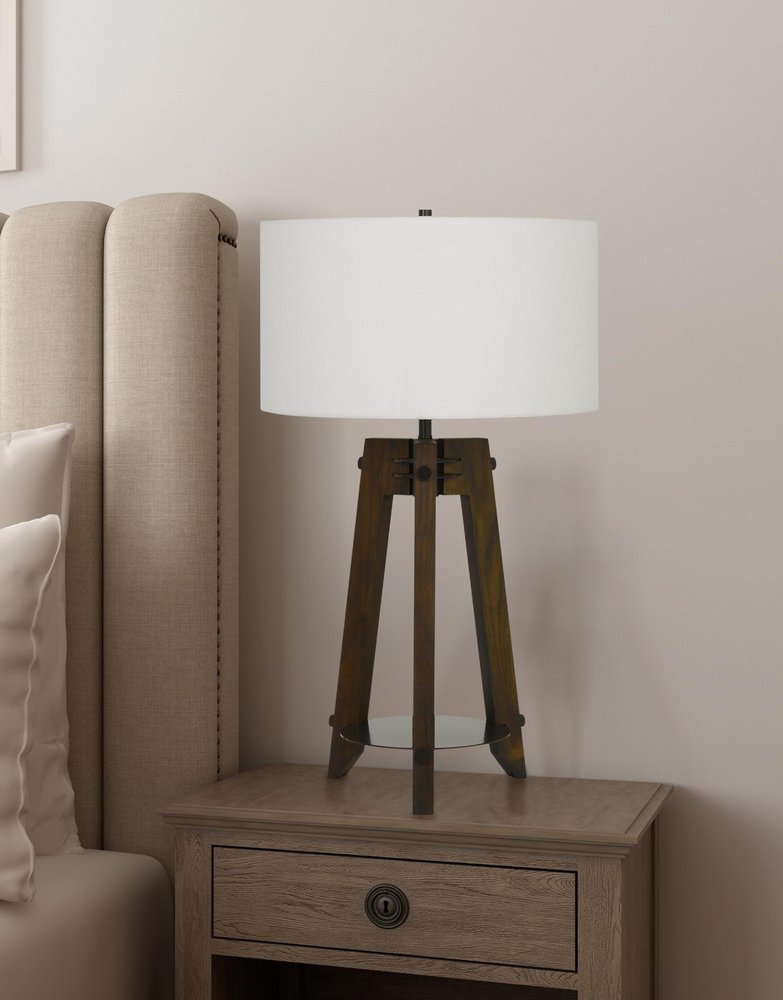32" Brown Metal Tripod Table Lamp With Off White Drum Shade close-up highlighting the off-white metal surface.