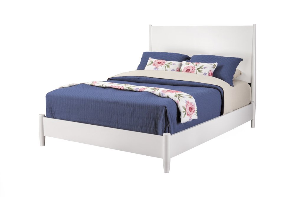 White solid wood queen bed frame with navy blue bedding and floral accent pillows on a white background.
