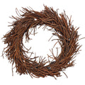 28" Brown Artificial Wreath. Wreath isolated on a plain white background, in a brown rattan finish.