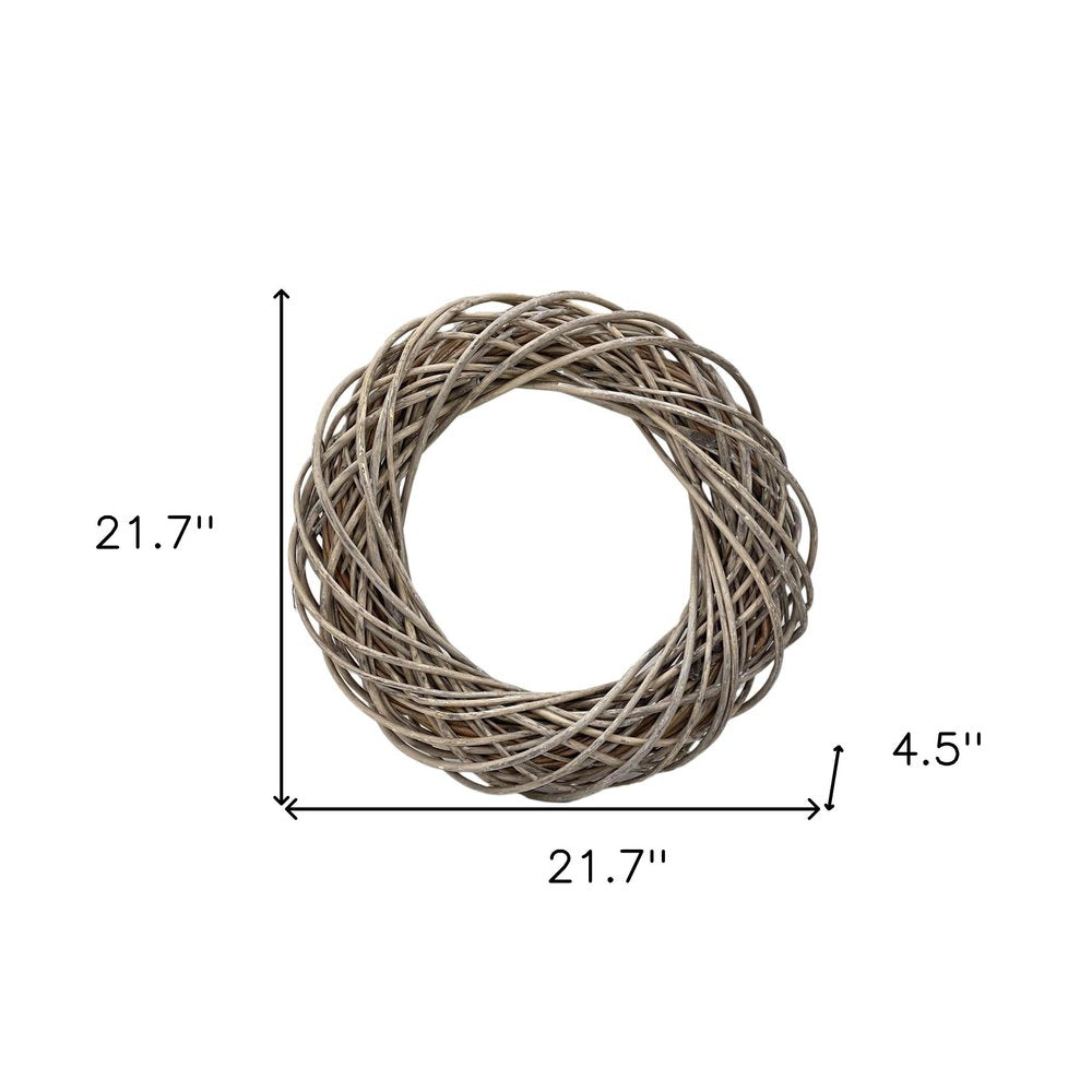 22" Natural Gray Willow Dried Wreath. Wreath isolated on a plain white background, in a tan wood finish.