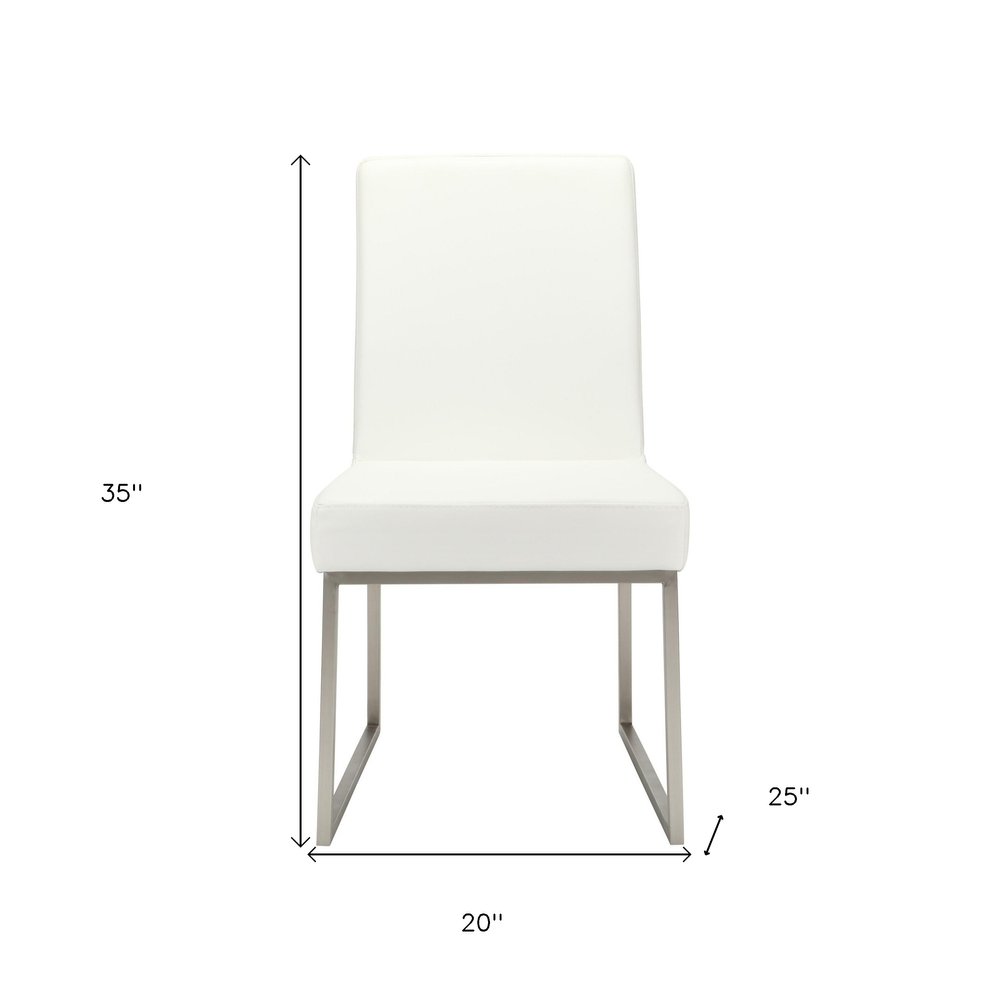 Set of Two White and Silver Faux Leather Dining Side Chairs - 35.00" H x 20.00" W x 25.00" D on a white background