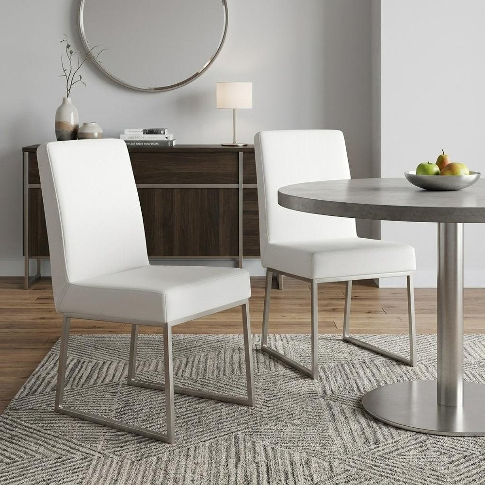 Set of Two White and Silver Faux Leather Dining Side Chairs - 35.00" H x 20.00" W x 25.00" D in a home interior