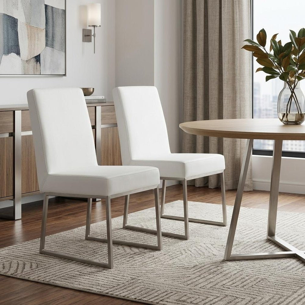 Set of Two White and Silver Faux Leather Dining Side Chairs - 35.00" H x 20.00" W x 25.00" D in a home interior