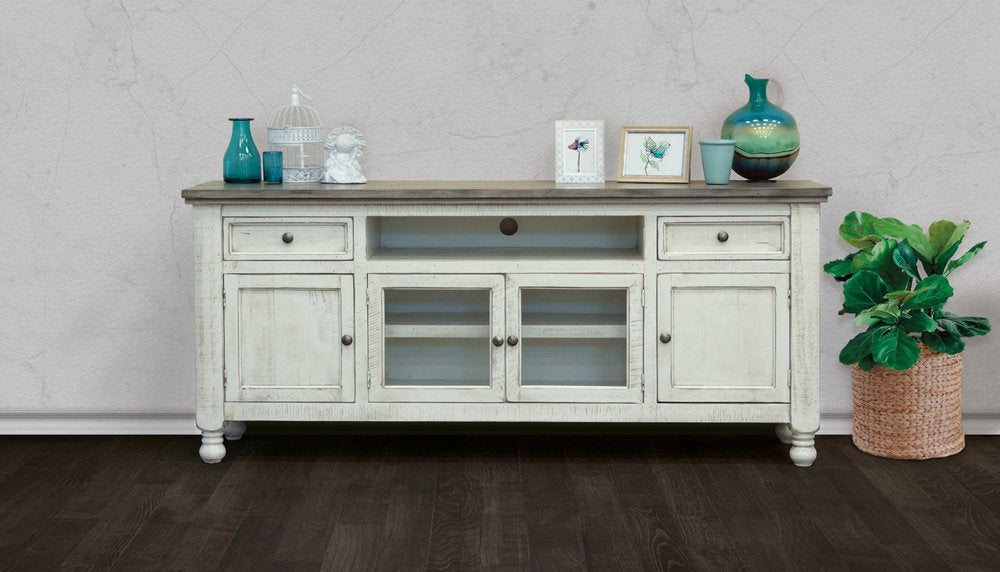 Ivory distressed solid wood TV stand with glass doors and open shelving on a textured gray wall background.