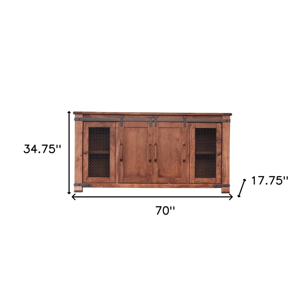 Brown solid wood cabinet with four doors and metal mesh accents, 70" W x 34.75" H x 17.75" D.