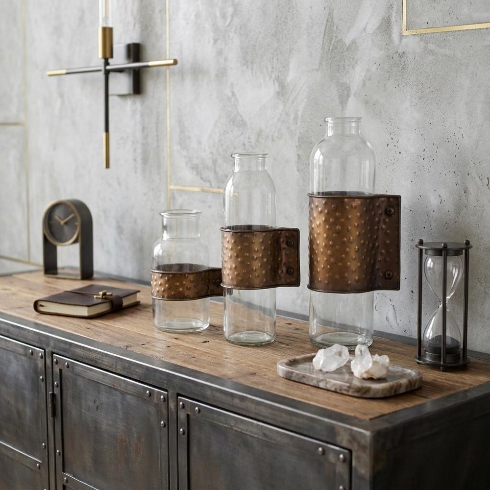 Set of Three Clear and Bronze Hammered Cylinder Metal and Glass Table Vase in a home interior