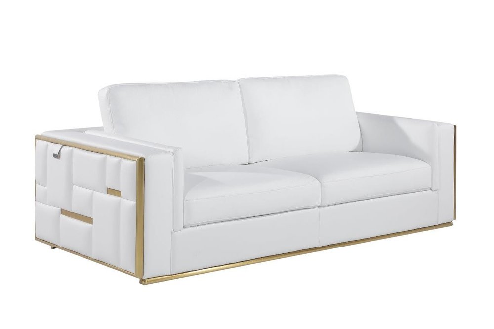 White Italian leather sofa with brass legs and a geometric design on the armrest, shown against a white background.