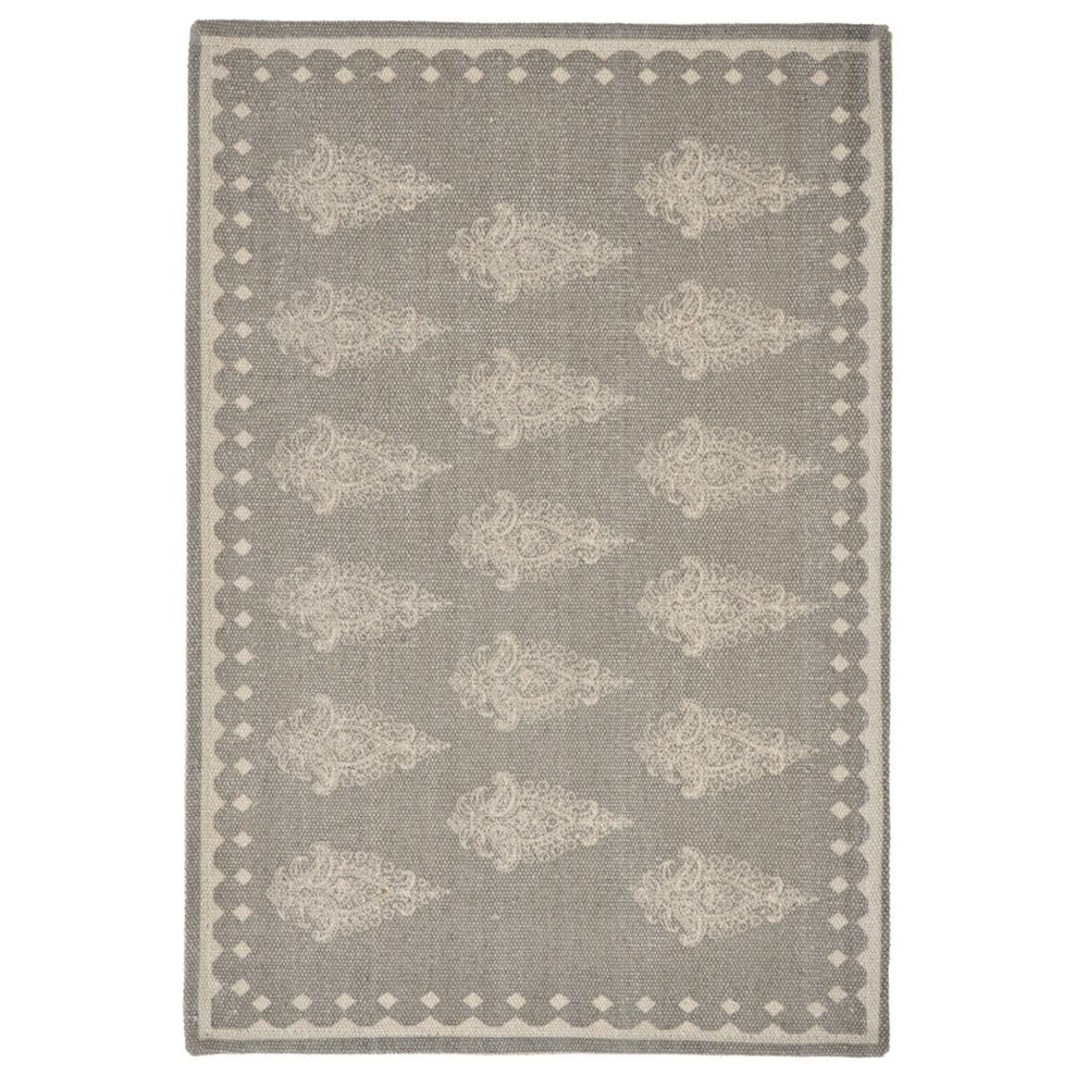 19" Set of Four Gray And Cream Geometric Medallion Cotton Placemats. Dining linen isolated on a plain white background, in a cream linen finish.