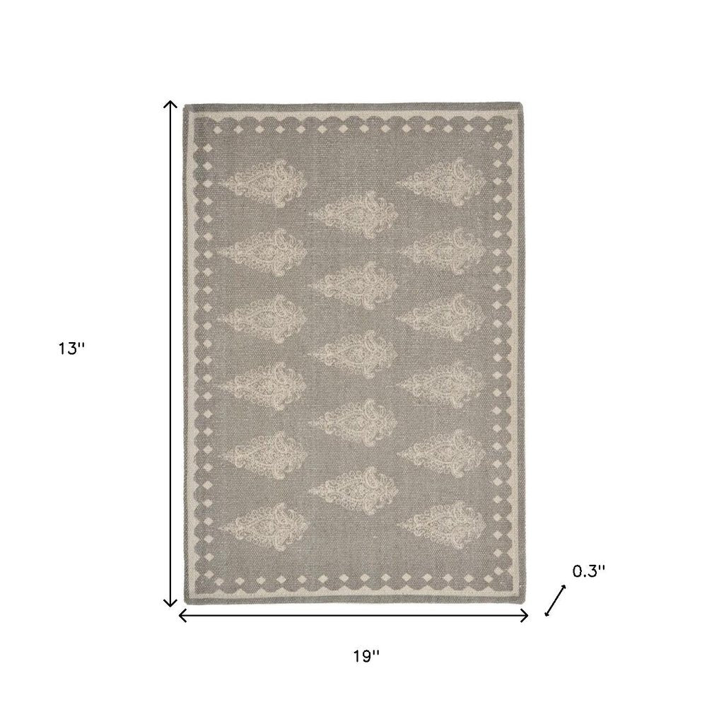 19" Set of Four Gray And Cream Geometric Medallion Cotton Placemats. Dining linen isolated on a plain white background, finished in cream linen.