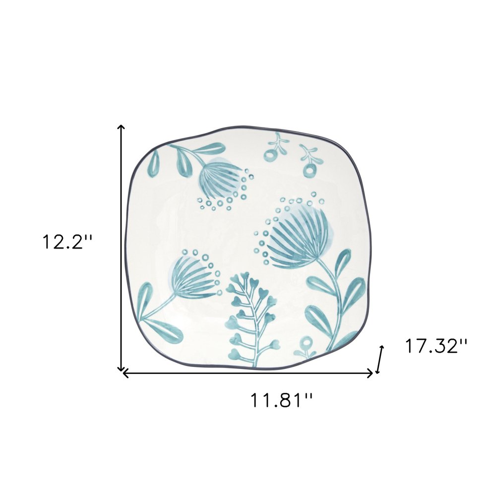 Blue and White Sixteen Piece Round Floral Ceramic Service For Four Dinnerware Set on a white background
