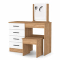 A freestanding bathroom vanity with four white drawers and a natural wood finish, featuring a mirror and a matching stool against a white background.