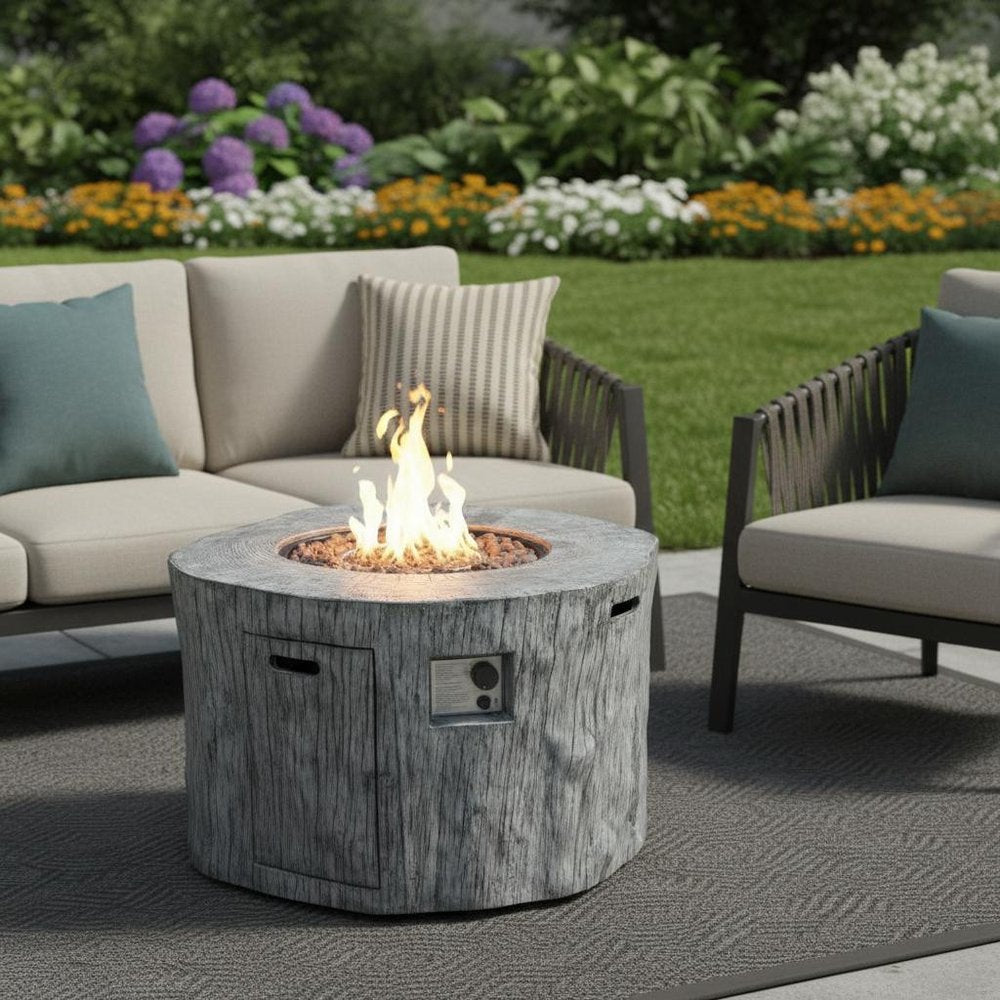 50000 BTU 40" Gray Aluminum Natural Gas Round Fire Pit Table With Cover shown outdoors on a tiled patio with greenery.