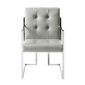 Set of Two Tufted Light Gray and Silver Metallic Upholstered Faux Leather Dining Arm Chairs on a white background