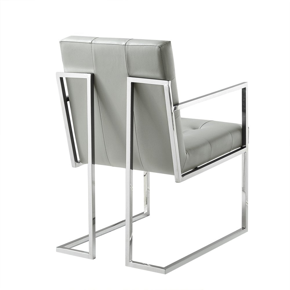 Set of Two Tufted Light Gray and Silver Metallic Upholstered Faux Leather Dining Arm Chairs on a white background