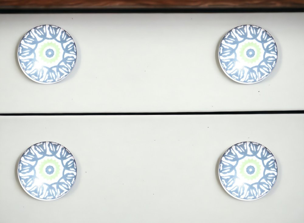 Set of Eight Light Blue And White Ceramic And Metal Drawer Pull Knobs in a home interior