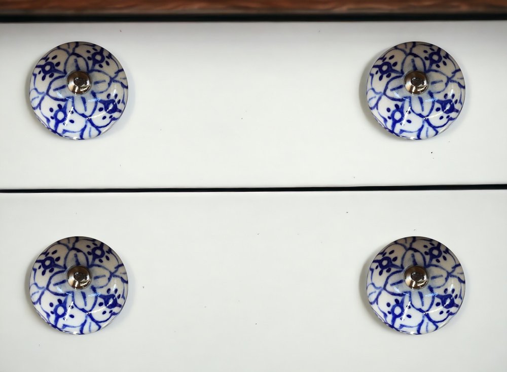 Set of Eight Blue And White Ceramic And Metal Drawer Pull Knobs in a home interior