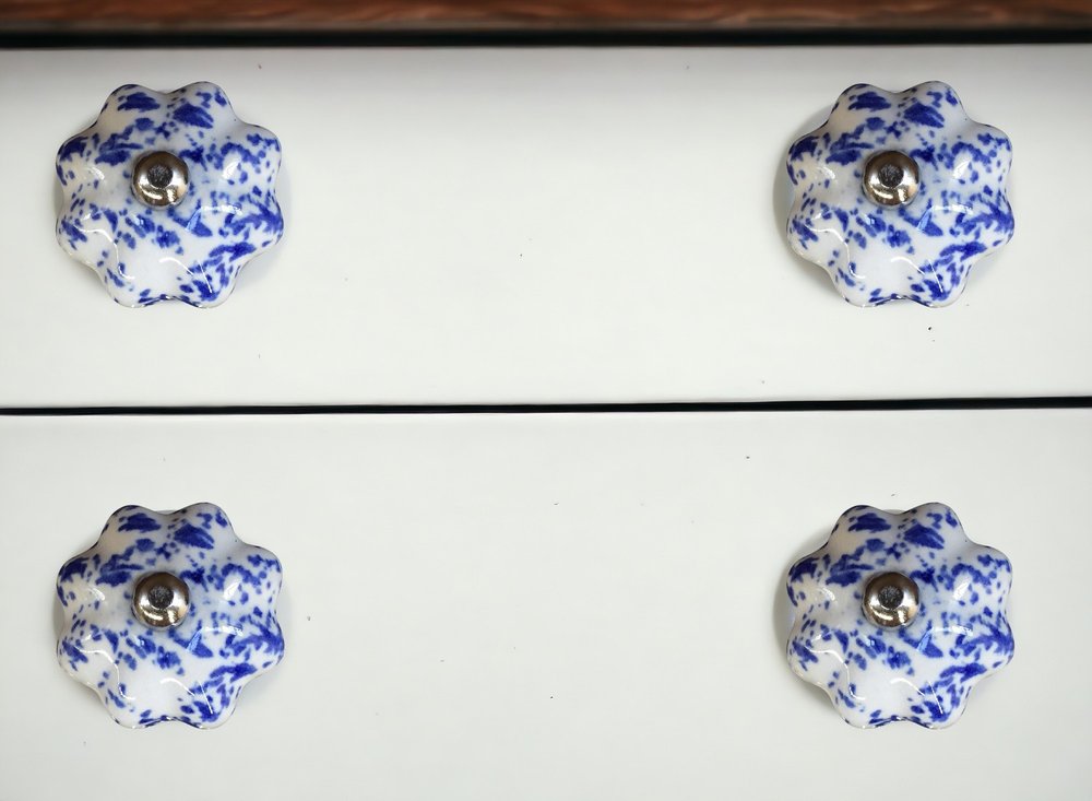 Set of Eight Blue And White Ceramic And Metal Drawer Pull Knobs in a home interior