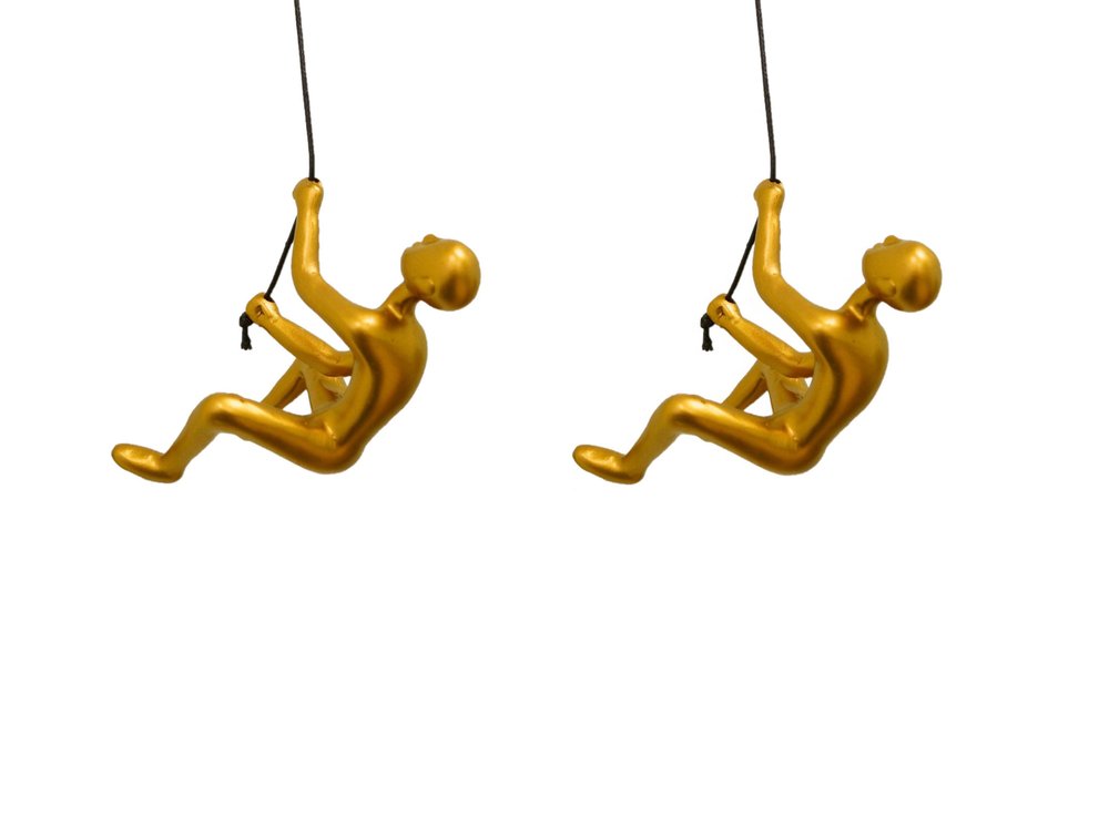 Set of Two Gold Resin Climbing Man Hanging Dimensional Sculpture on a white background