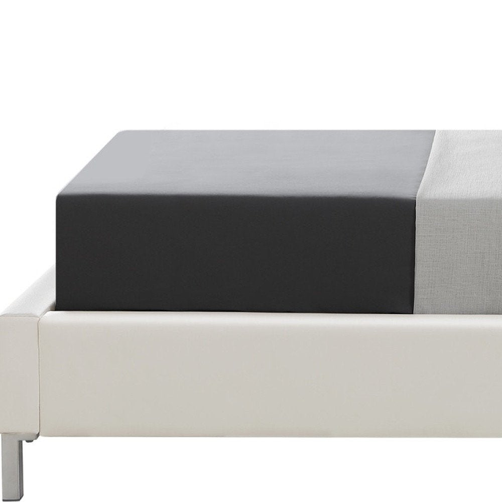 White Solid Wood Twin Upholstered Faux Leather Bed Frame with Nailhead Trim on a white background