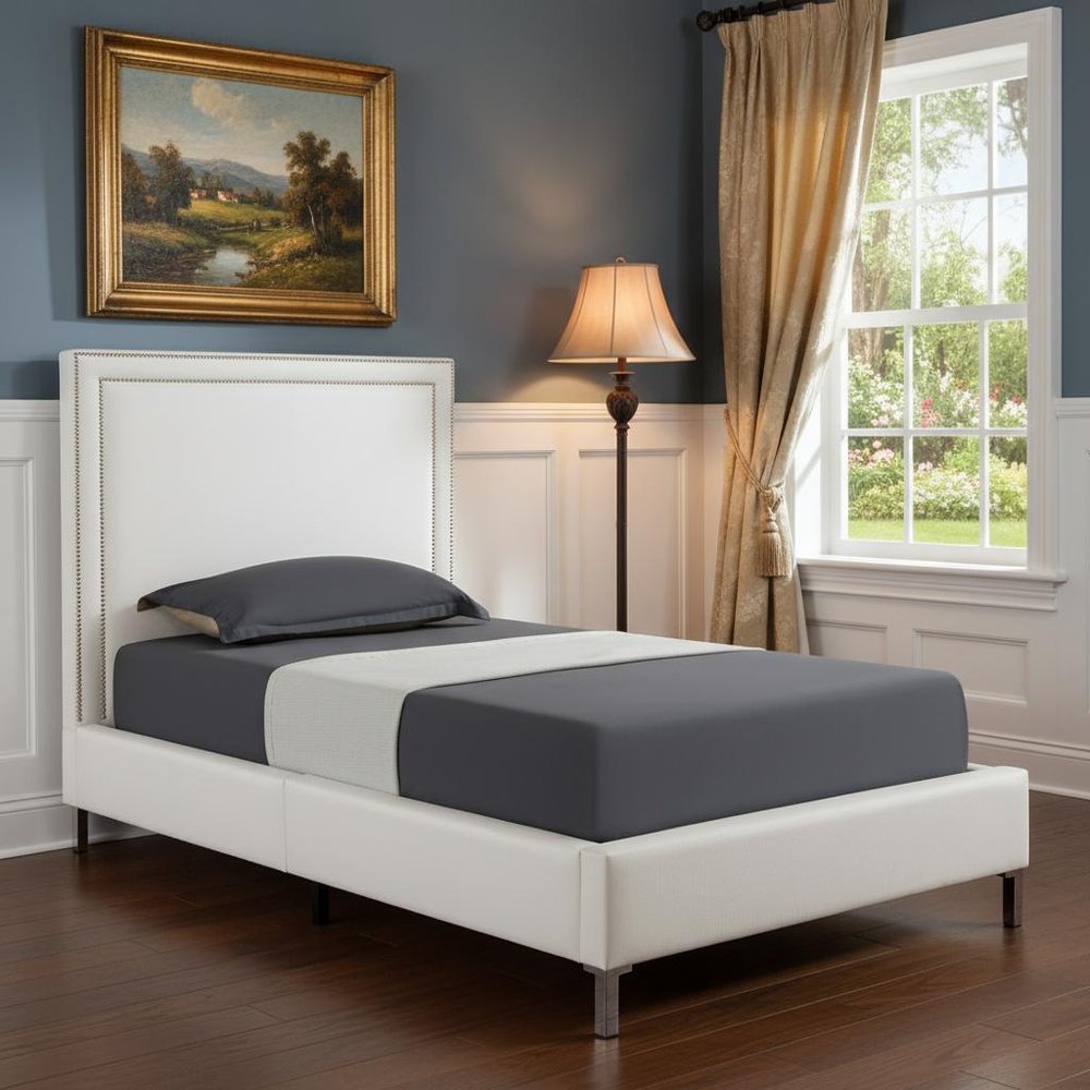 White Solid Wood Twin Upholstered Faux Leather Bed Frame with Nailhead Trim in a home interior