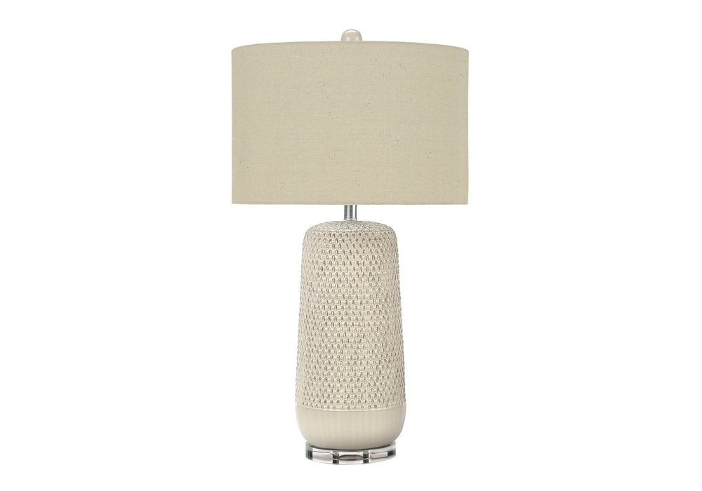 31" Cream Ceramic Geometric Table Lamp With Beige Drum Shade. Table lamp isolated on a plain white background, in a cream ceramic finish.