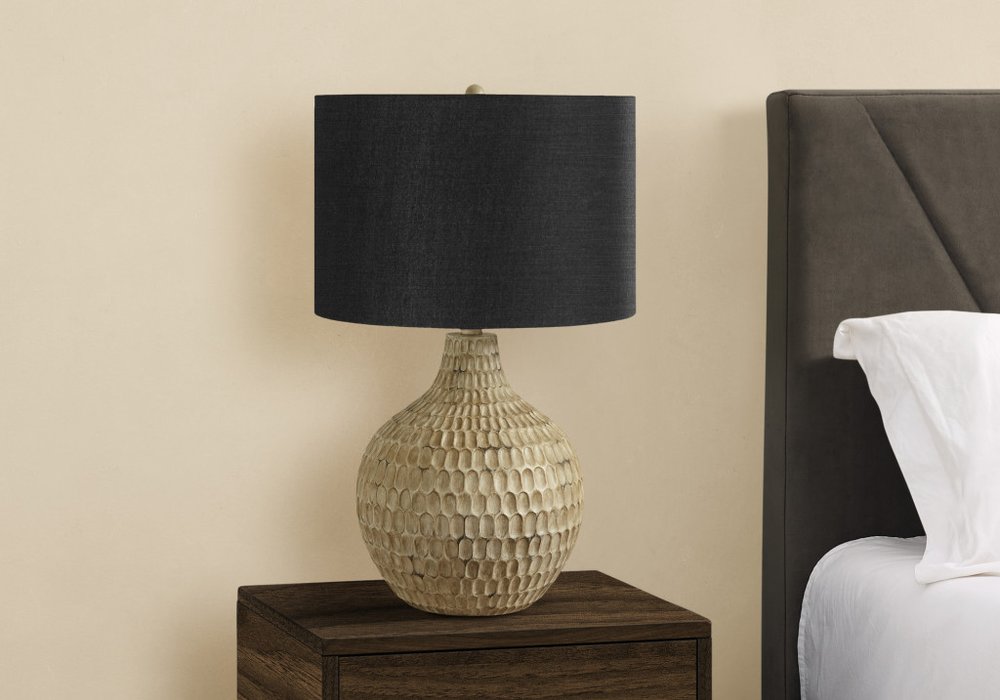 Detail view of 25" Brown Geometric Table Lamp With Black Drum Shade, filling the frame with the black texture.