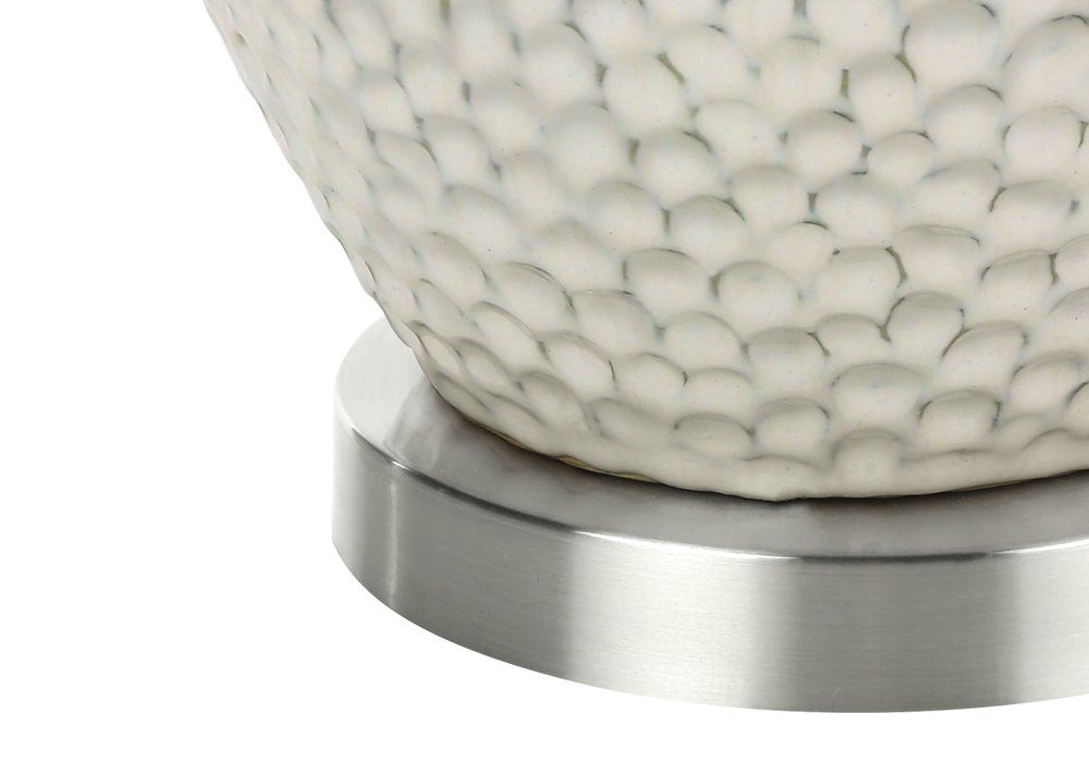 28" White and Silver Ceramic Round Table Lamp With Cream Drum Shade. Table lamp isolated on a plain white background, finished in cream ceramic.
