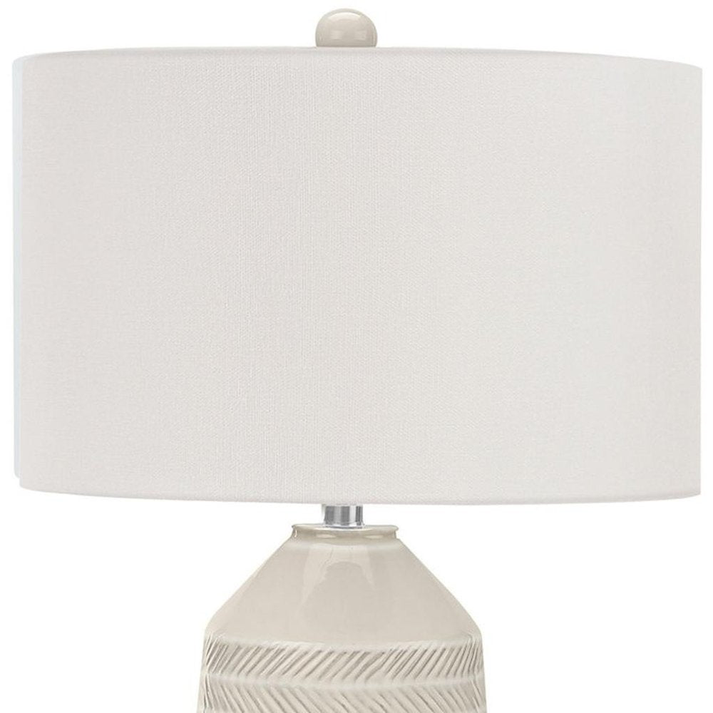 33" Ivory Ceramic Geometric Table Lamp With Cream Drum Shade. Table lamp isolated on a plain white background, in a ivory ceramic finish.