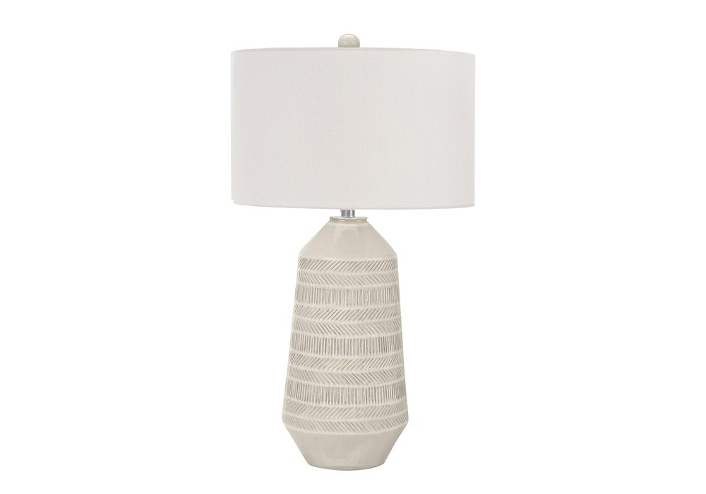 33" Ivory Ceramic Geometric Table Lamp With Cream Drum Shade. Table lamp isolated on a plain white background, showing a ivory ceramic surface.