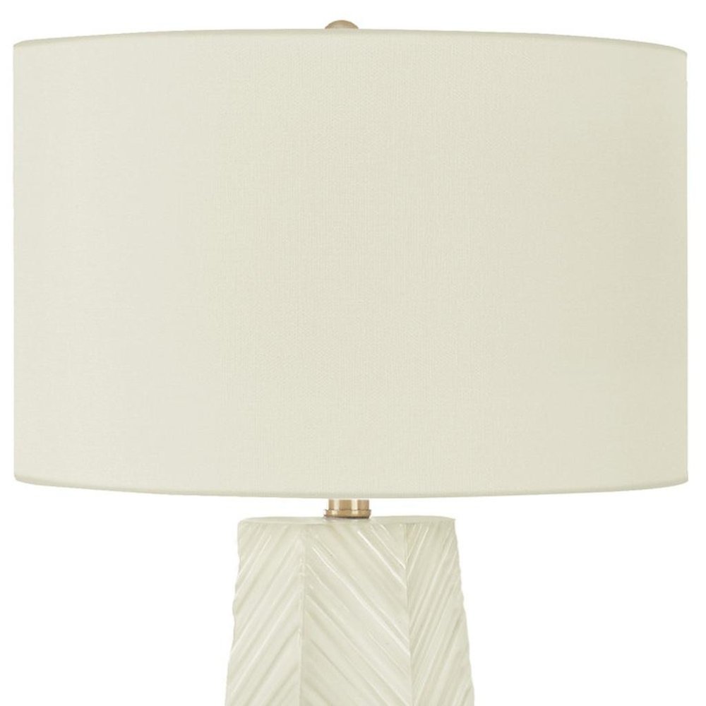29" White Ceramic Geometric Table Lamp With Ivory Drum Shade. Table lamp isolated on a plain white background, in a ivory ceramic finish.