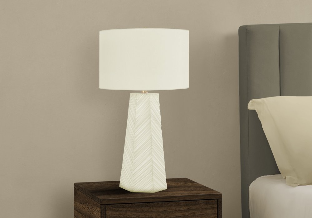 Close-up of 29" White Ceramic Geometric Table Lamp With Ivory Drum Shade showing the ivory ceramic texture.