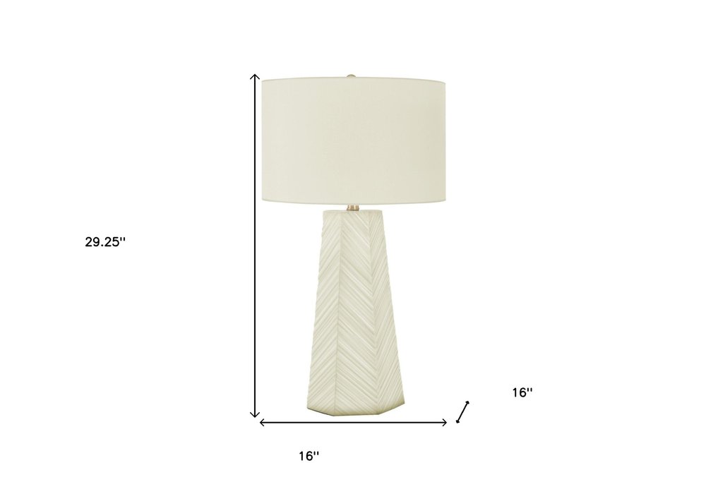 29" White Ceramic Geometric Table Lamp With Ivory Drum Shade. Table lamp isolated on a plain white background, showing a ivory ceramic surface.