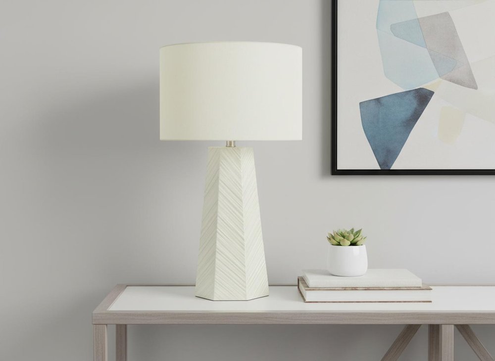 29" White Ceramic Geometric Table Lamp With Ivory Drum Shade. Table lamp in ivory ceramic.