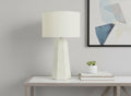 29" White Ceramic Geometric Table Lamp With Ivory Drum Shade. Table lamp in ivory ceramic.