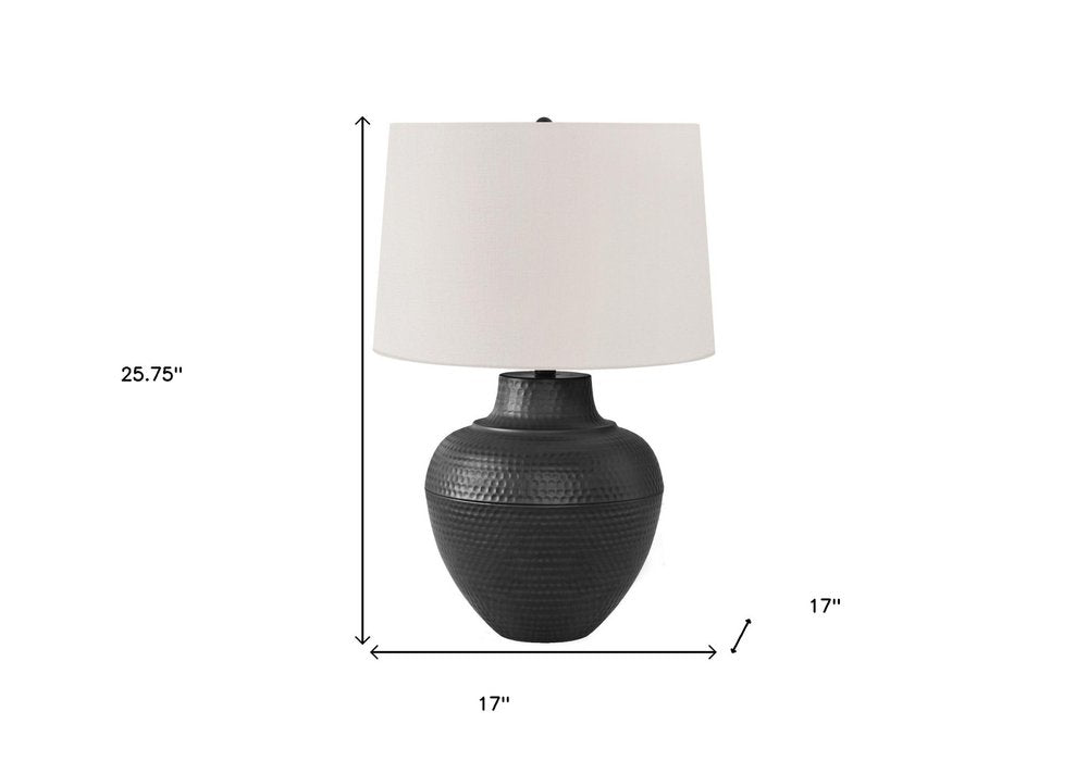 26" Black Metal Urn Table Lamp With Cream Empire Shade. Table lamp isolated on a plain white background, showing a cream metal surface.