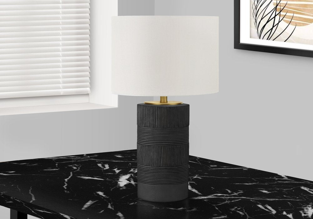 24" Black Cylinder Table Lamp With Ivory Drum Shade photographed against a dark studio background in ivory.