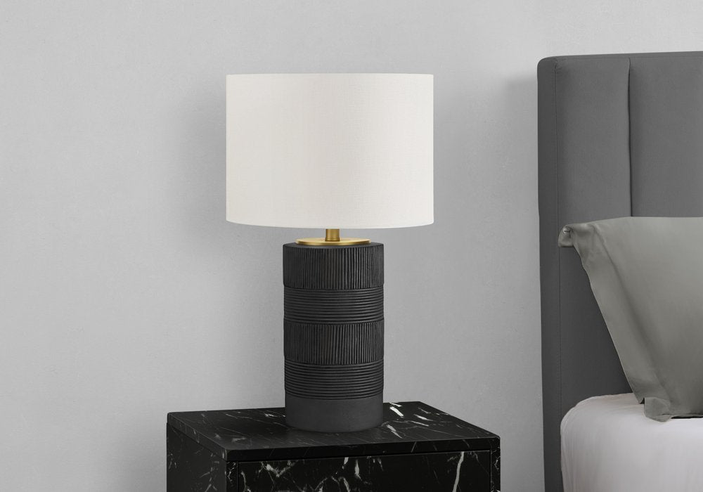24" Black Cylinder Table Lamp With Ivory Drum Shade. Table lamp isolated on a plain white background, finished in black.