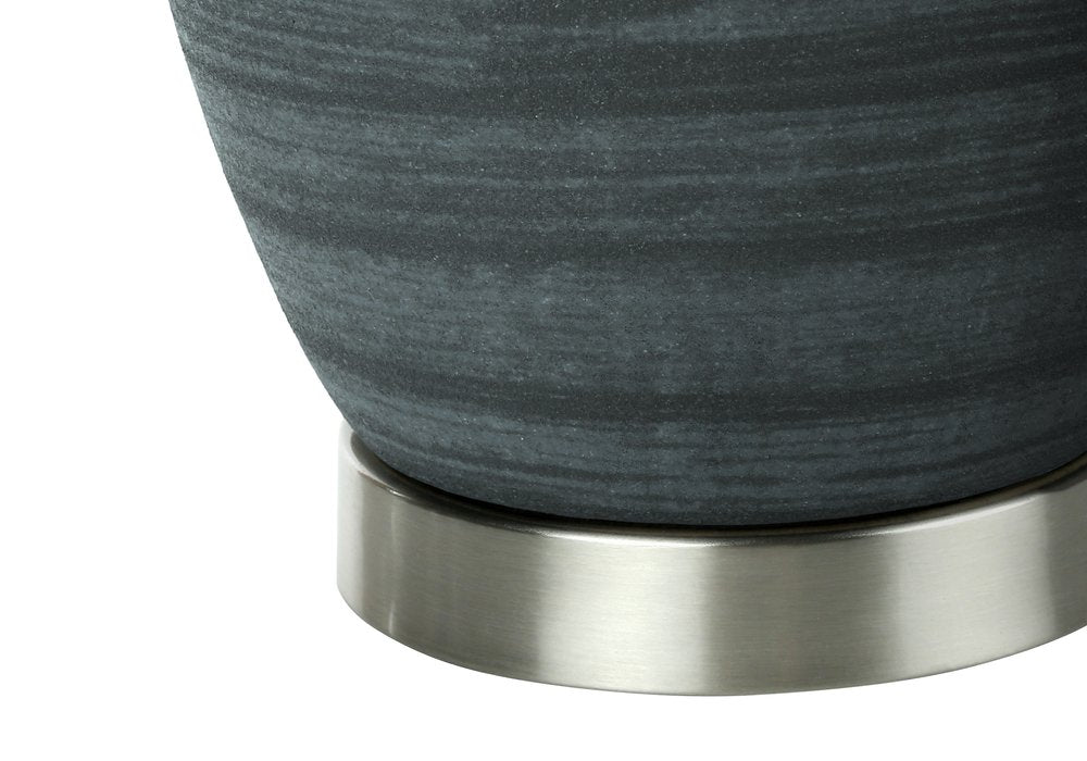 24" Blue and Silver Ceramic Round Table Lamp With Ivory Drum Shade. Table lamp isolated on a plain white background, finished in silver ceramic.