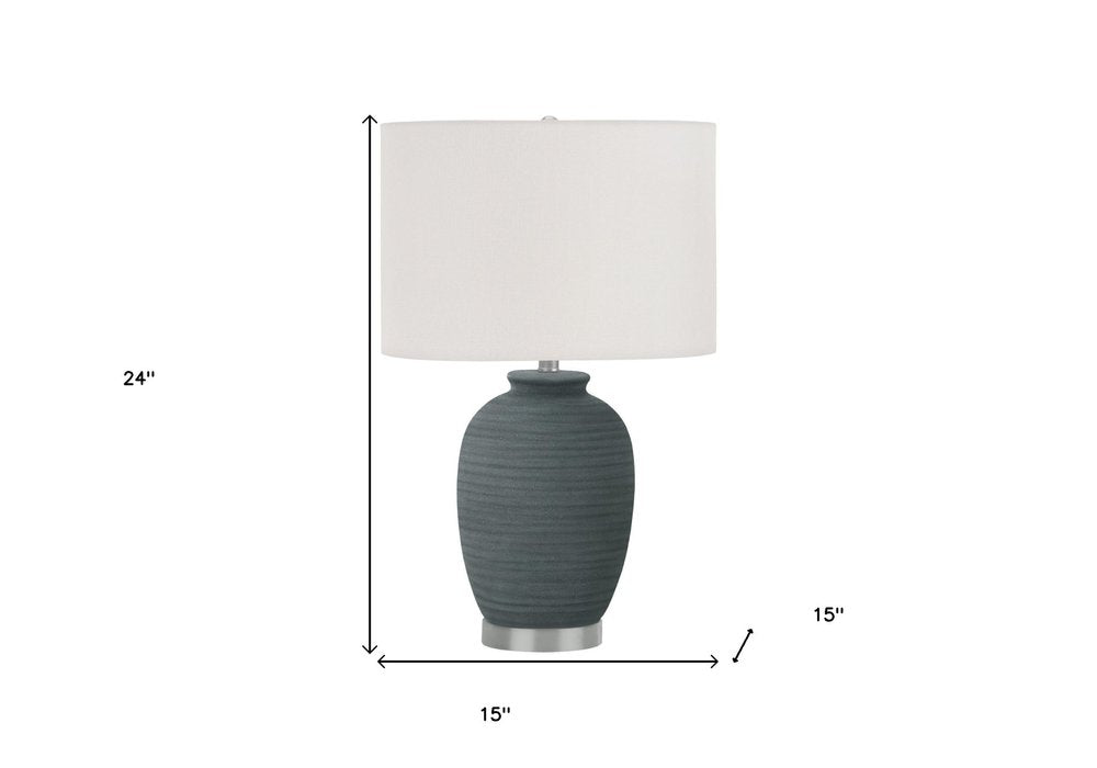 24" Blue and Silver Ceramic Round Table Lamp With Ivory Drum Shade. Table lamp isolated on a plain white background, in a ivory ceramic finish.