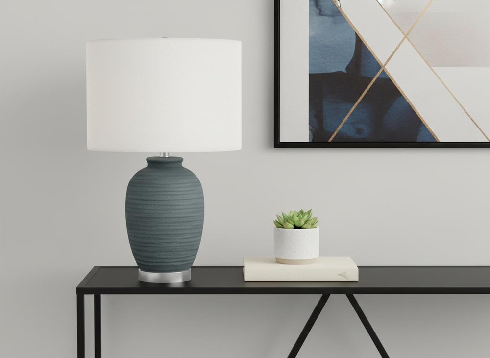 24" Blue and Silver Ceramic Round Table Lamp With Ivory Drum Shade. Table lamp isolated on a plain white background, in a ivory ceramic finish.