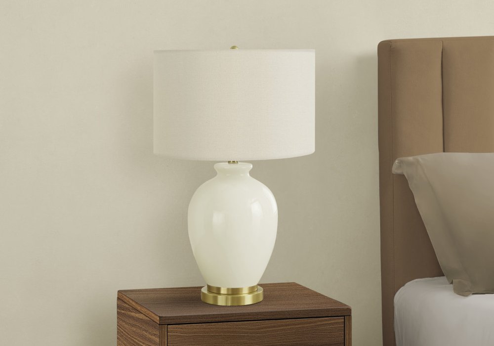 Close-up of 26" Gold and Ivory Ceramic Urn Table Lamp With Cream Drum Shade showing the ivory ceramic texture.