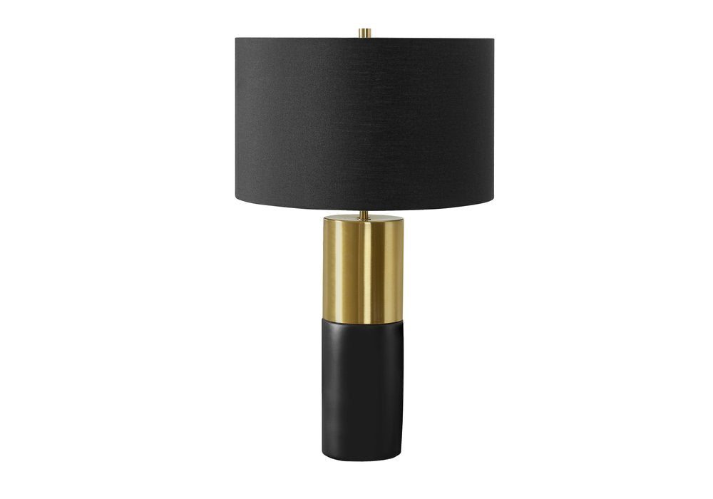 25" Black and Gold Concrete Cylinder Table Lamp With Black Drum Shade. Table lamp isolated on a plain white background, showing its gold color.