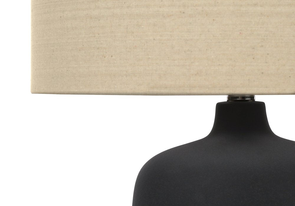 24" Black Ceramic Round Table Lamp With Beige Drum Shade. Table lamp in beige ceramic.