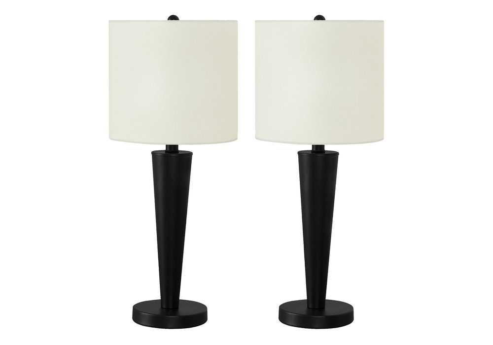 Two black metal candlestick table lamps with ivory drum shades on a white background.