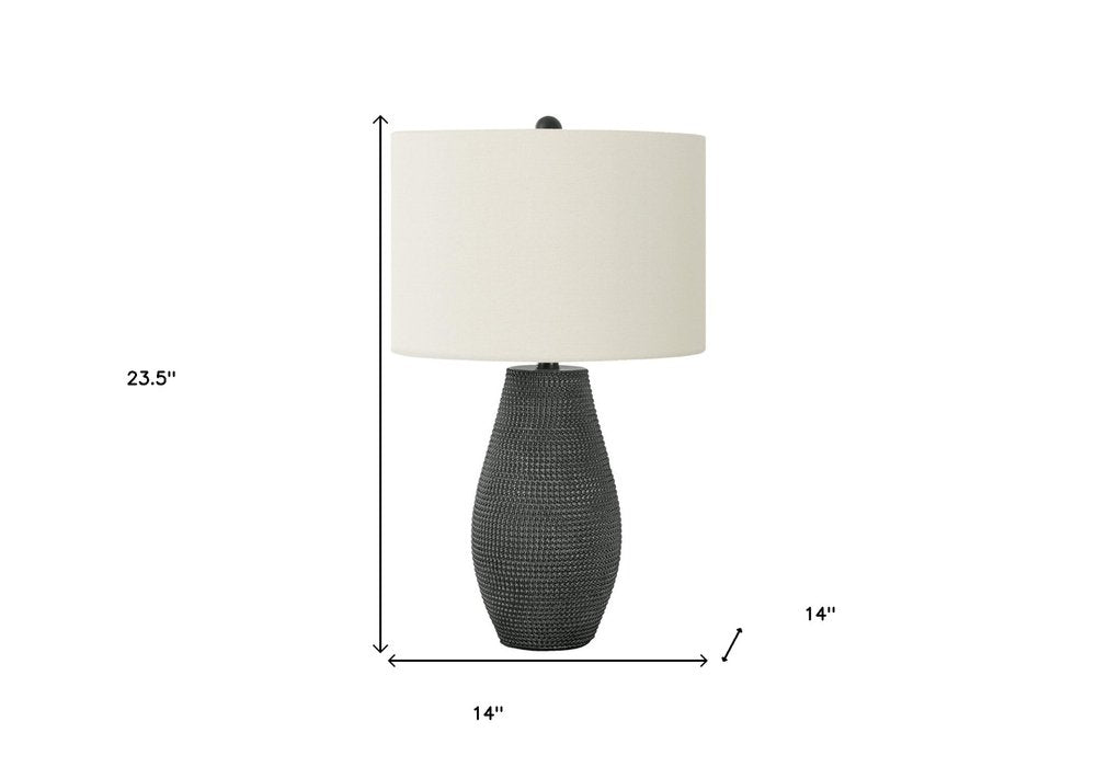 24" Black Round Table Lamp With Ivory Drum Shade. Table lamp isolated on a plain white background, showing its ivory color.