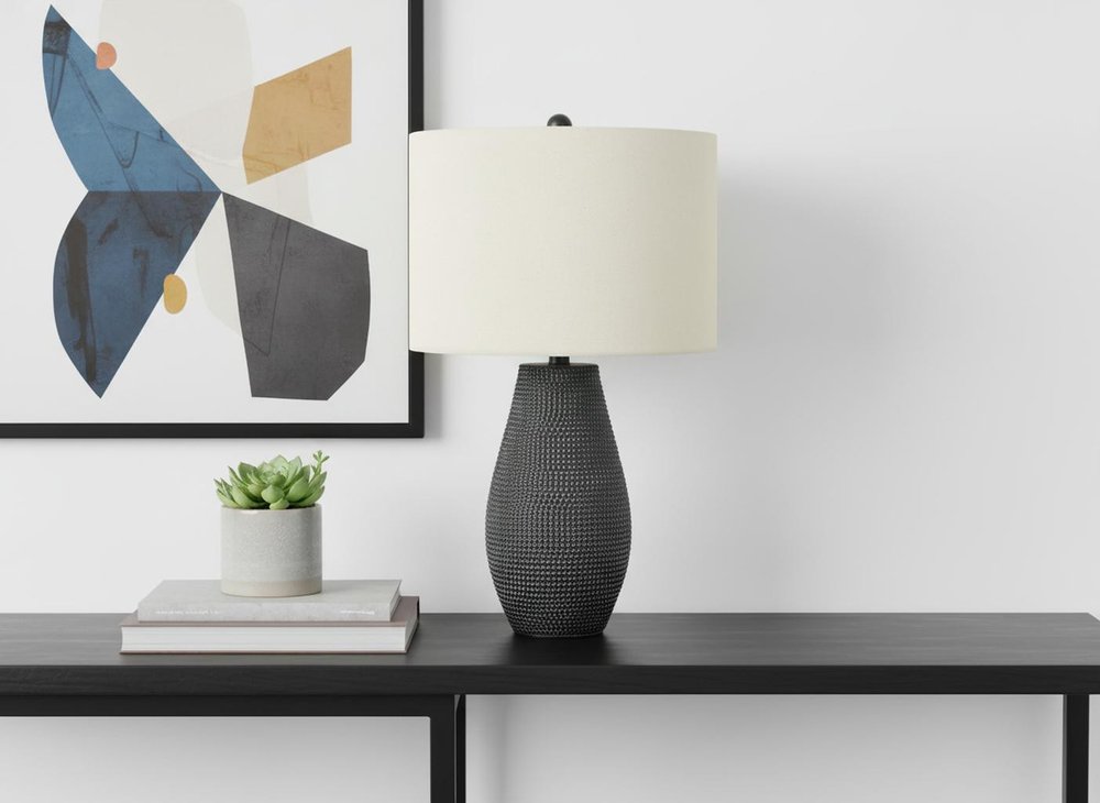 24" Black Round Table Lamp With Ivory Drum Shade. Table lamp isolated on a plain white background, showing its ivory color.