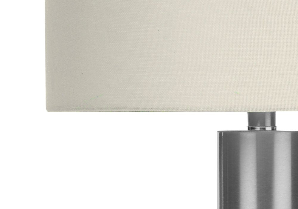 28" Silver Acrylic Cylinder Table Lamp With Ivory Drum Shade. Table lamp in ivory.