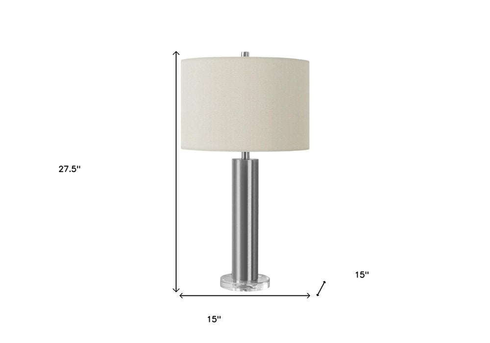 28" Silver Acrylic Cylinder Table Lamp With Ivory Drum Shade. Table lamp isolated on a plain white background, in a ivory finish.