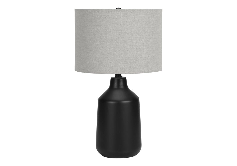 24" Black Concrete Urn Table Lamp With Gray Drum Shade. Table lamp isolated on a plain white background, showing its black color.
