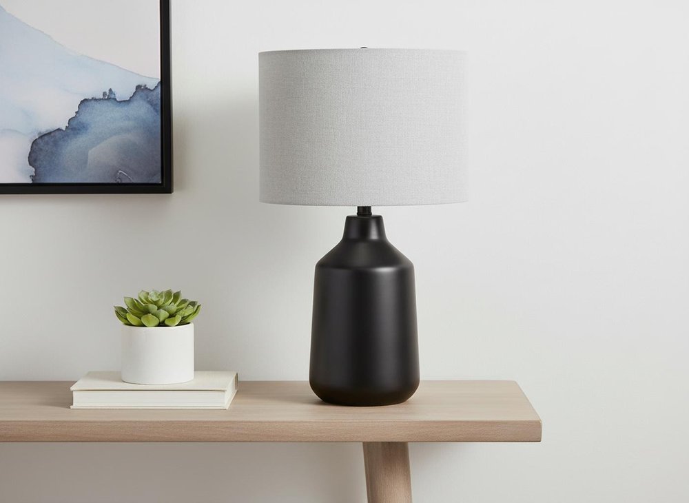24" Black Concrete Urn Table Lamp With Gray Drum Shade. Table lamp in gray.